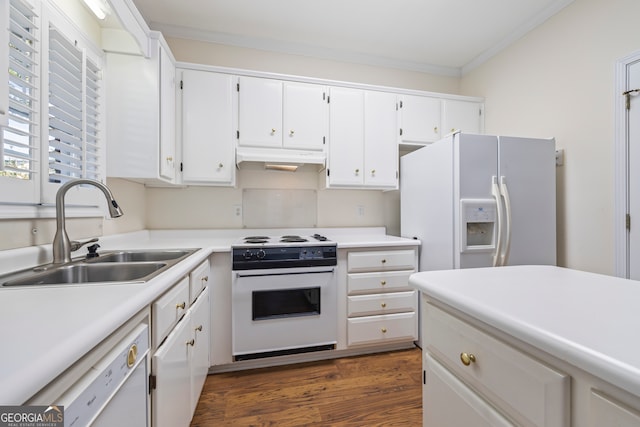 kitchen featuring sink, white cabinetry, and white appliances