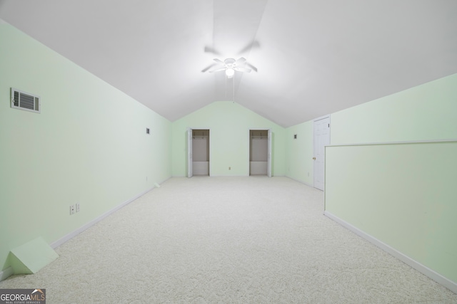 bonus room featuring light carpet, lofted ceiling, and ceiling fan