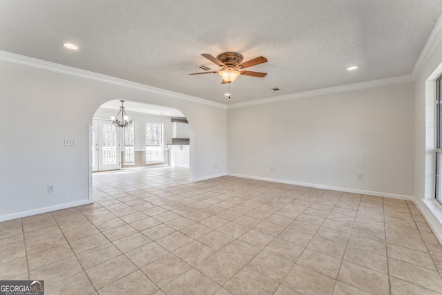 empty room featuring arched walkways, a textured ceiling, crown molding, and ceiling fan with notable chandelier