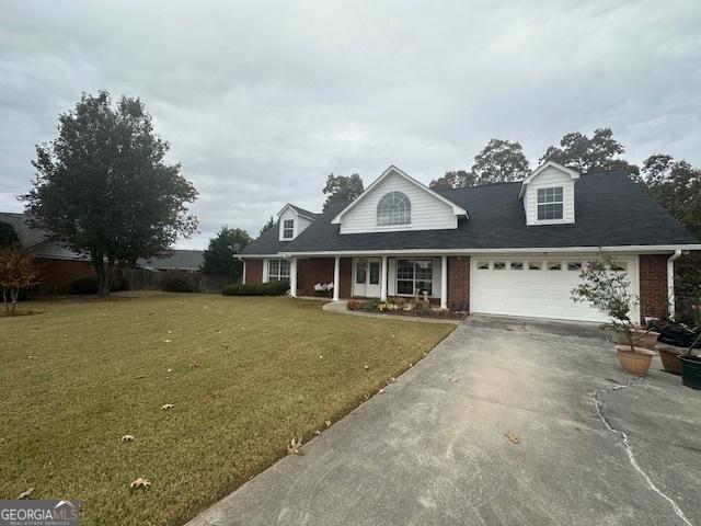 cape cod-style house with a front lawn and a garage