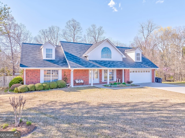 cape cod-style house with brick siding, driveway, fence, and an attached garage