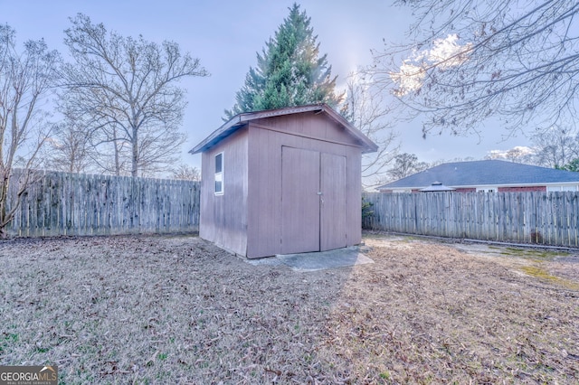 view of shed featuring a fenced backyard