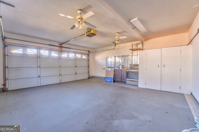 garage featuring a garage door opener and ceiling fan