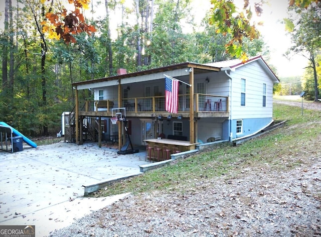 back of house with a patio