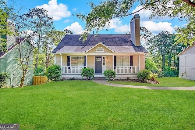 view of front of home featuring a front yard and a porch