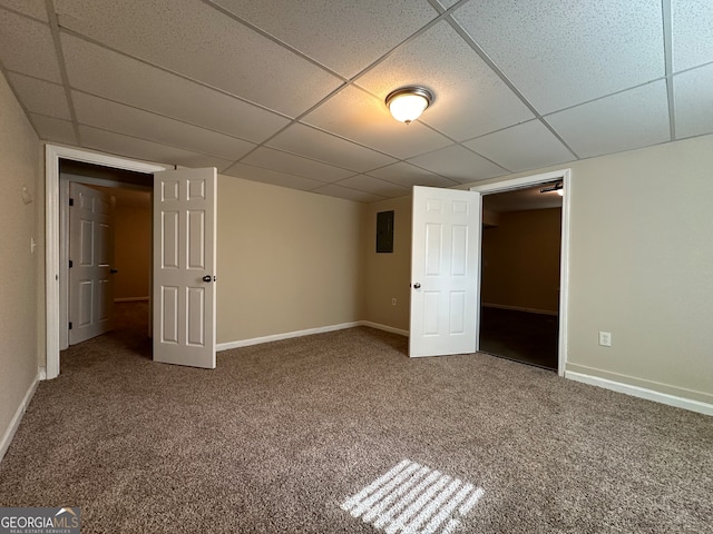 interior space with a drop ceiling and carpet floors