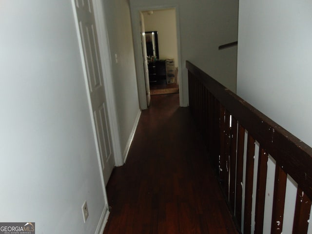 hall with dark hardwood / wood-style floors