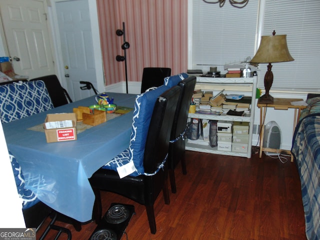 dining room with dark wood-type flooring