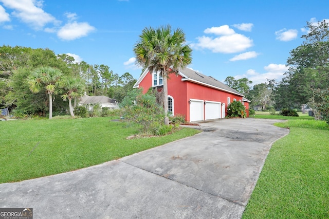 view of home's exterior with a yard and a garage