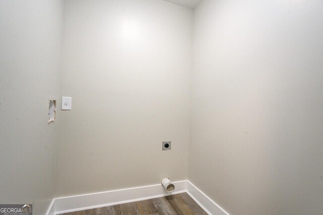 laundry room with dark hardwood / wood-style floors and electric dryer hookup