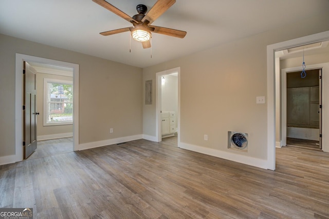 unfurnished bedroom with ceiling fan, light hardwood / wood-style floors, ensuite bathroom, and a closet