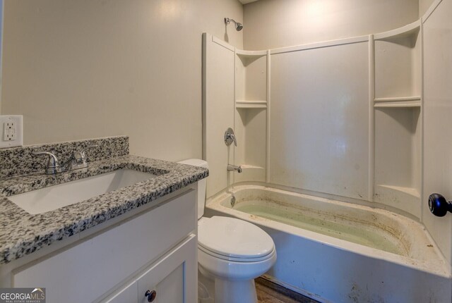 full bathroom with toilet, washtub / shower combination, and vanity