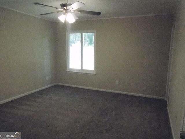 unfurnished room with ceiling fan, baseboards, and dark colored carpet