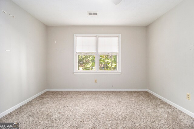 unfurnished room featuring carpet flooring