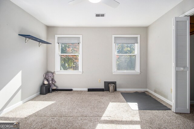 unfurnished bedroom with carpet floors and ceiling fan