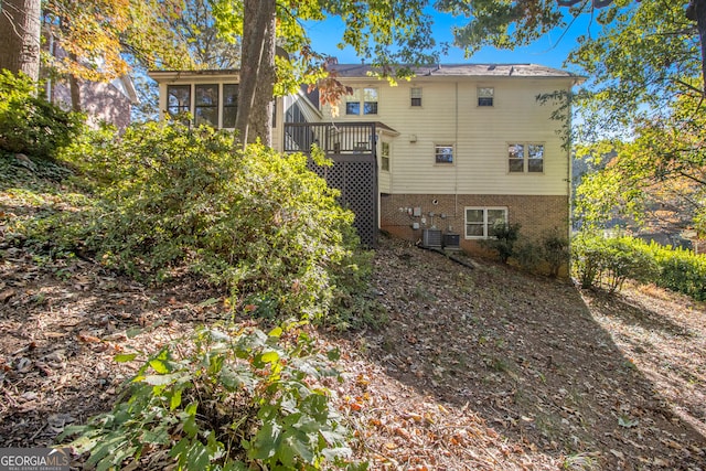 back of house featuring a deck