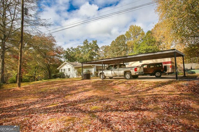 back of house with a deck and a lawn