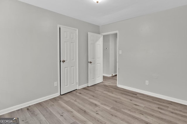 unfurnished bedroom with light hardwood / wood-style floors