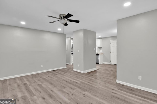 unfurnished living room featuring light hardwood / wood-style floors and ceiling fan