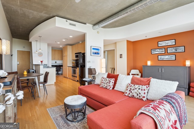 living room with light hardwood / wood-style flooring