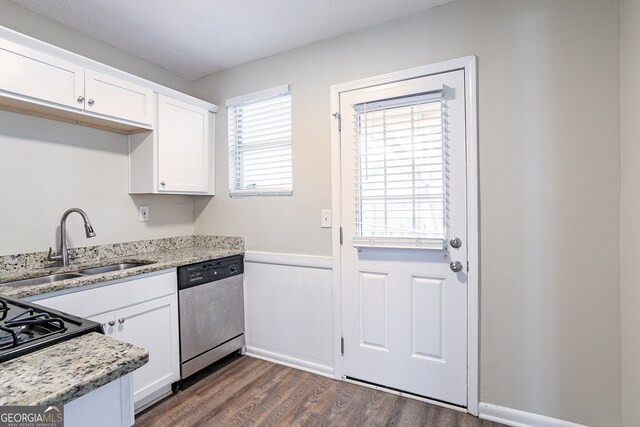 kitchen featuring white cabinetry, dark wood-type flooring, dishwasher, and sink