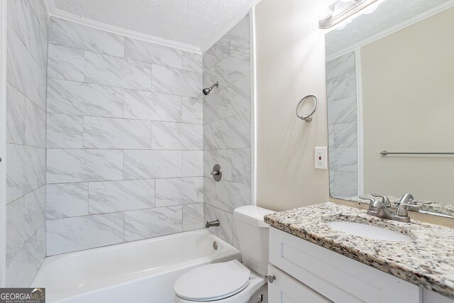 full bathroom with a textured ceiling, toilet, tiled shower / bath, vanity, and crown molding