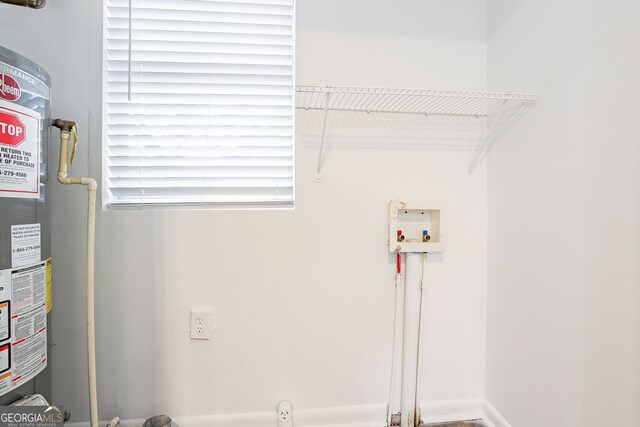 washroom featuring hookup for a washing machine and water heater