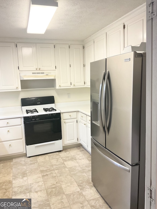 kitchen with white range, stainless steel fridge with ice dispenser, a textured ceiling, and white cabinets