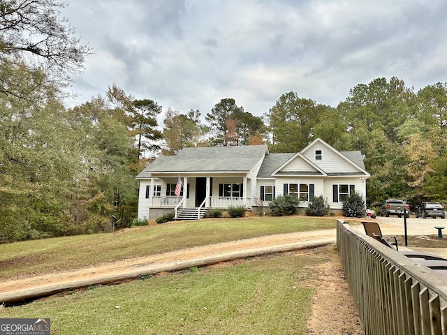 view of front of home featuring a front lawn and covered porch