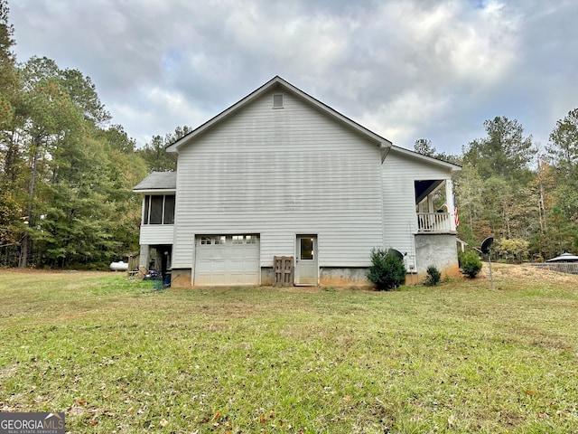 view of property exterior featuring a yard and a garage