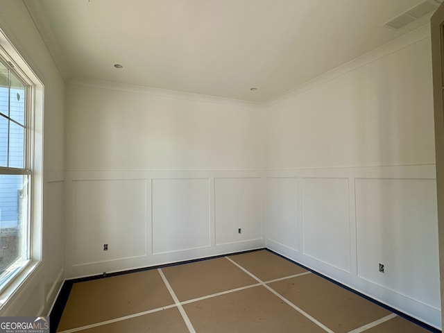 spare room featuring ornamental molding