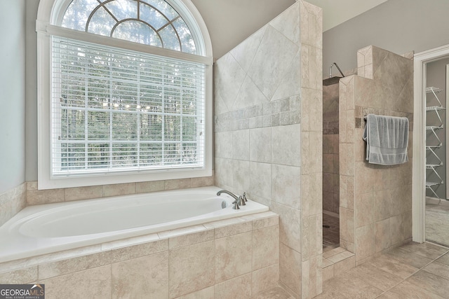 bathroom with plenty of natural light and independent shower and bath