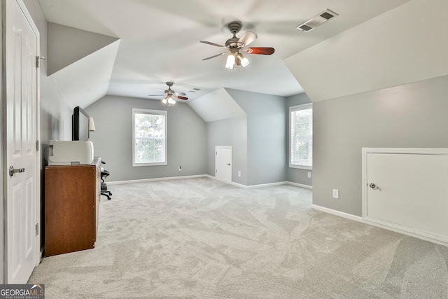 bonus room with ceiling fan, light carpet, and vaulted ceiling