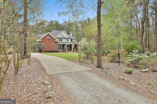 view of front of home featuring a garage and a front yard