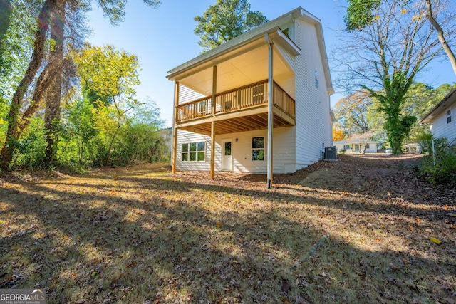 rear view of property featuring central air condition unit