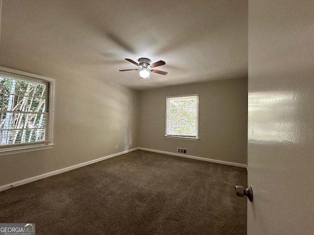 2425 Hanford Dr SW, Atlanta, GA 30315 - unfurnished room with ceiling fan, baseboards, and dark carpet
