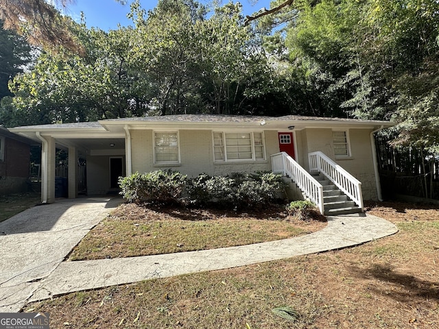 2425 Hanford Dr SW, Atlanta, GA 30315 - ranch-style home featuring concrete driveway, a carport, and brick siding