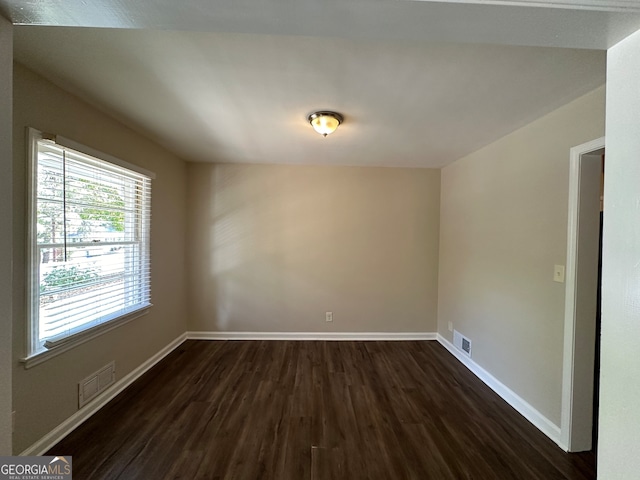 empty room featuring dark hardwood / wood-style floors