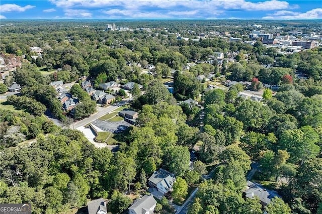 aerial view of property's location with a heavily wooded area