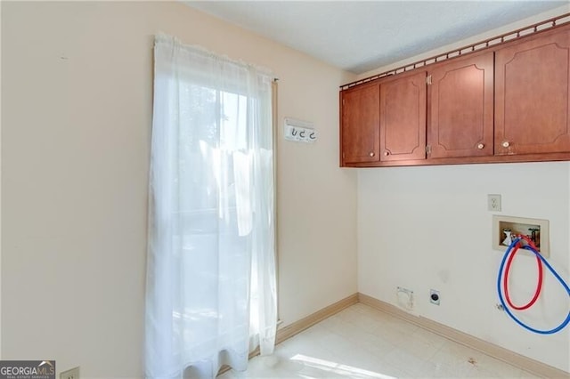 laundry area with washer hookup, cabinet space, hookup for an electric dryer, baseboards, and light flooring