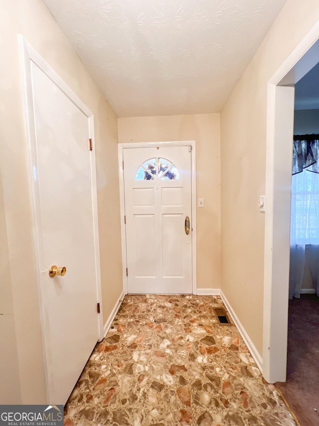 726 Victoria Cir, Dublin, GA 31021 - entryway with stone finish floors and baseboards