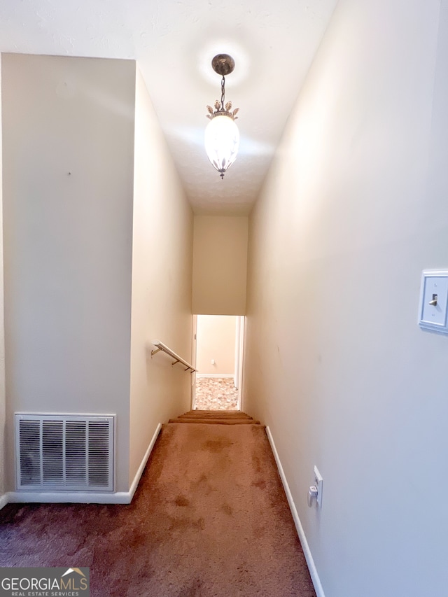 corridor featuring carpet flooring