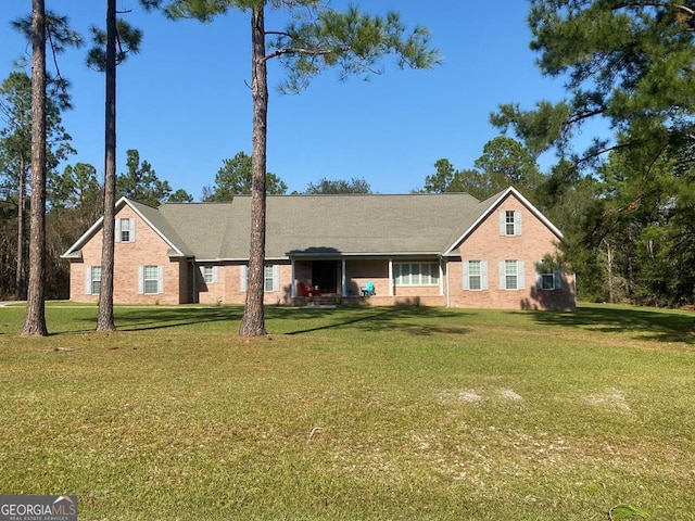 ranch-style home with a front lawn