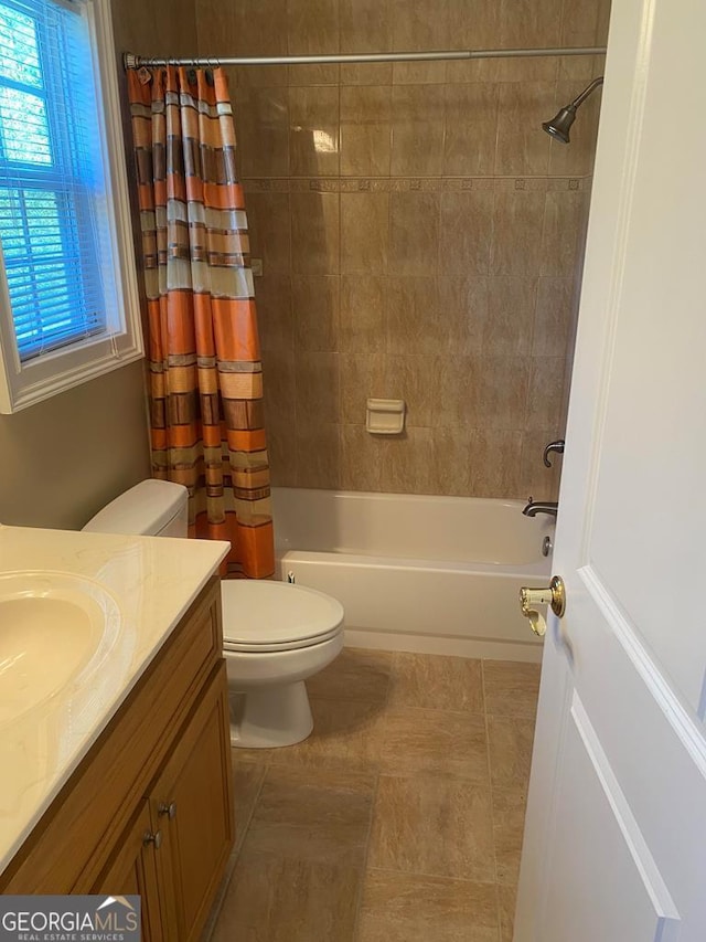 full bathroom featuring toilet, vanity, and shower / tub combo