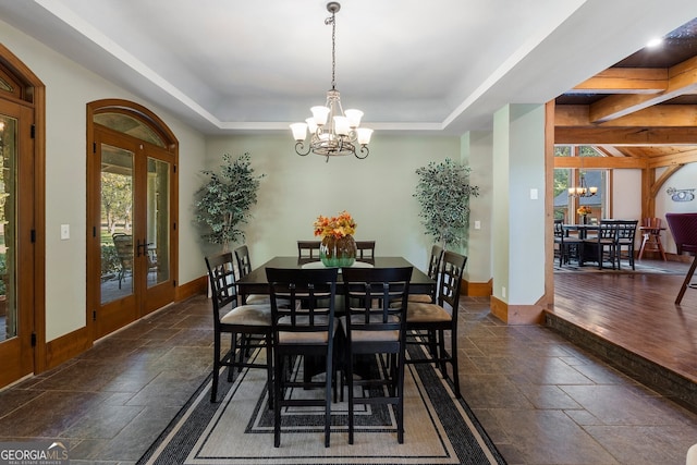 dining room featuring french doors, beam ceiling, a chandelier, and dark hardwood / wood-style flooring