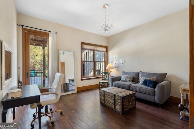 office featuring dark wood-type flooring and a notable chandelier