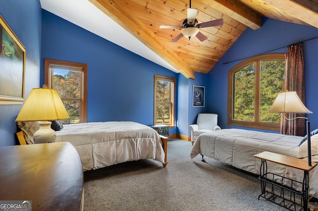 carpeted bedroom with lofted ceiling with beams and ceiling fan