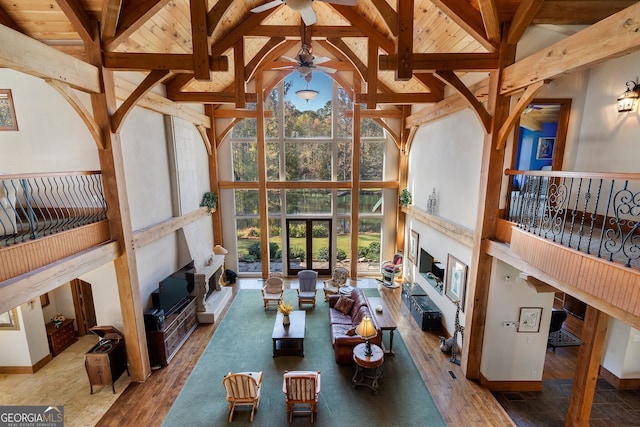 unfurnished sunroom featuring lofted ceiling with beams, wooden ceiling, and plenty of natural light