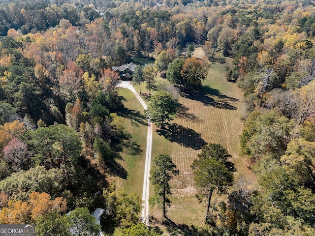 birds eye view of property with a rural view