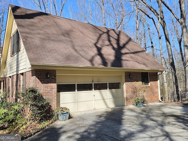 view of side of home with a garage